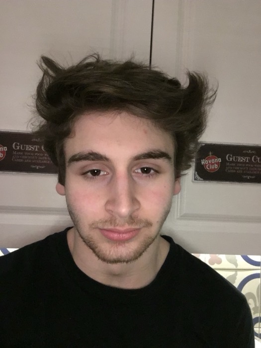 Joshua: messy-hair selfie at Havana Club hostel, Krakow.