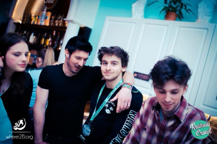 Joshua: friend hugging him at Krakow Crawl bar event