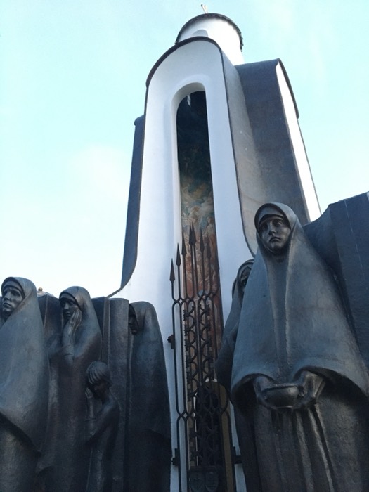 Low angle of Island of Tears chapel and grieving statues