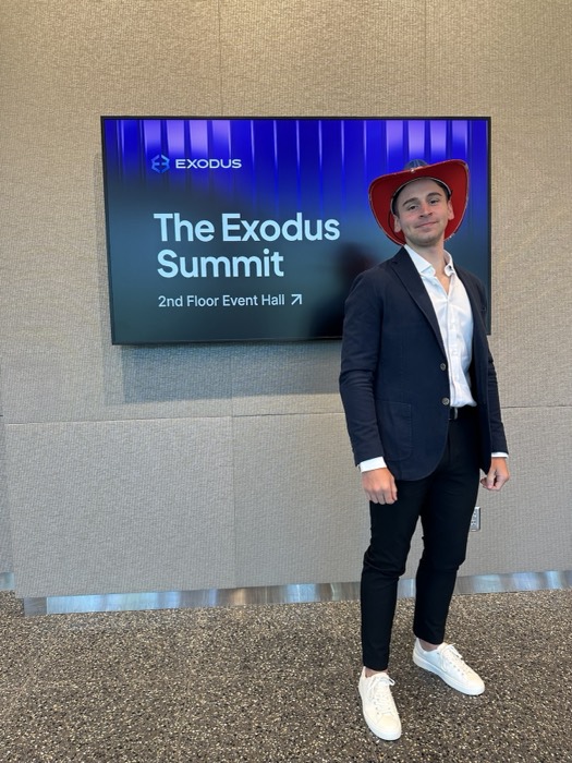 Joshua: full-length pose in blazer and cowboy hat at Exodus Summit