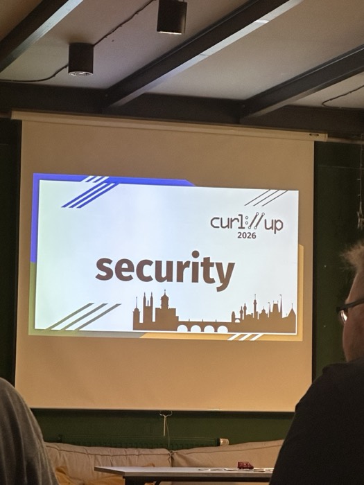 curl up 2026 conference talk slide titled security on projector screen