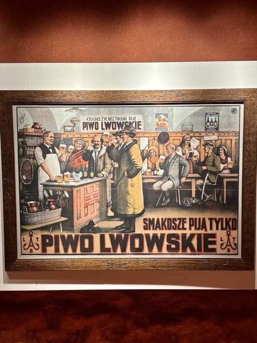 Antique Piwo Lwowskie beer poster, lively tavern illustration, framed