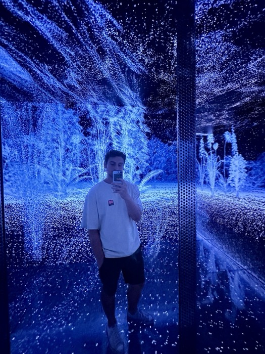 Joshua: mirror selfie in immersive blue light installation room
