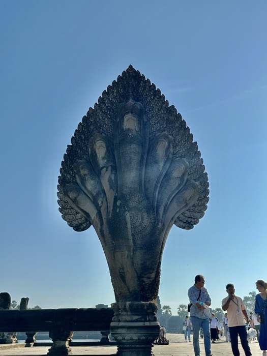 Bayon temple stone face towers under deep blue sky at Angkor Thom