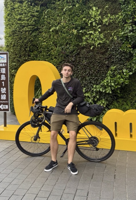 Joshua: with touring bike at station, near-identical edited duplicate