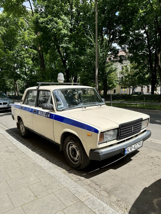 Near-identical vintage Lada Milicja police car on street