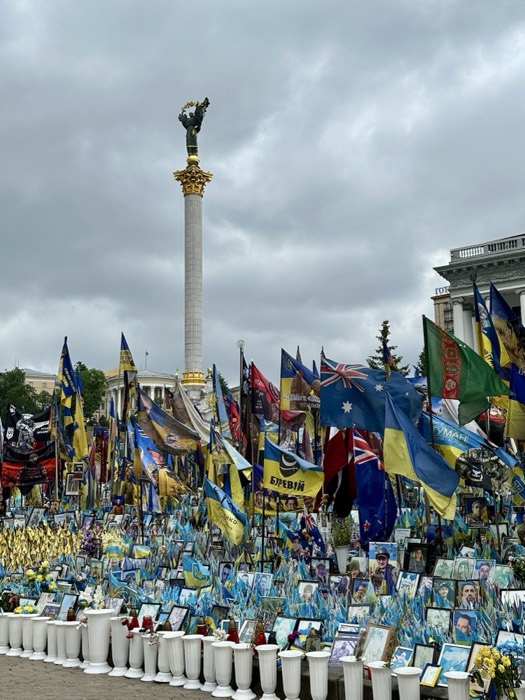 Maidan Square memorial: flags, photos of fallen soldiers under Independence Monument