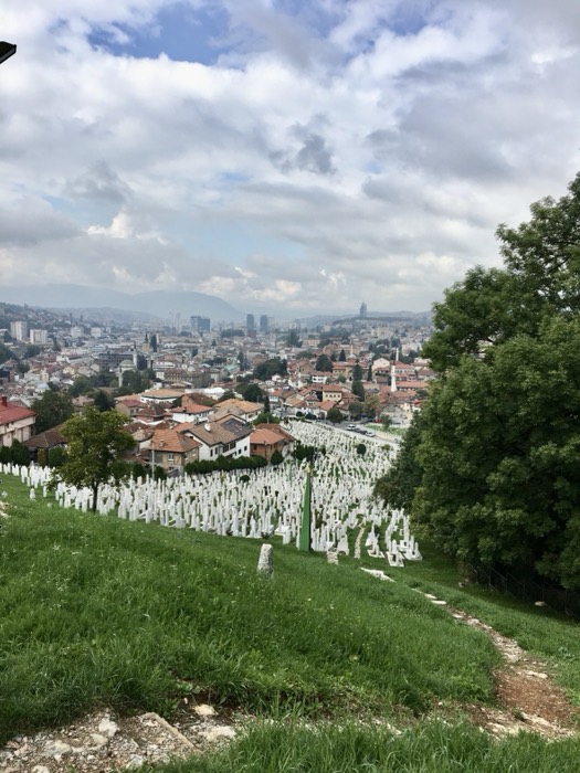 White war graves on hillside above Sarajevo skyline