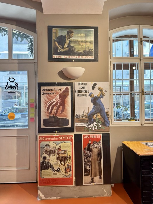 Edited propaganda-poster wall, near-identical to original.