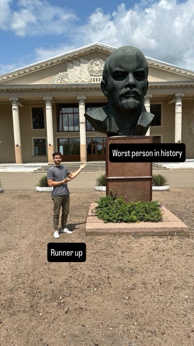 Joshua: mock-presenting giant Lenin bust outside Soviet-era cultural building