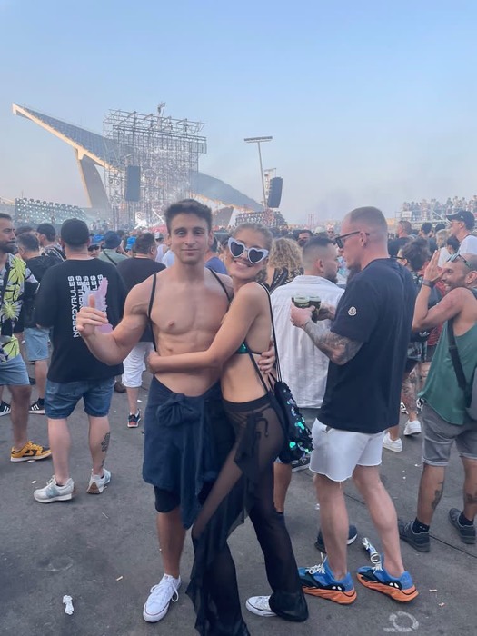Joshua: with girlfriend at Off Week Festival, stage rigging behind