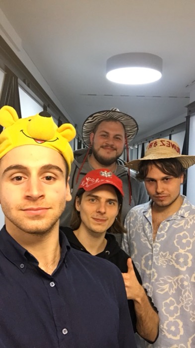 Joshua: selfie with three friends all wearing funny hats